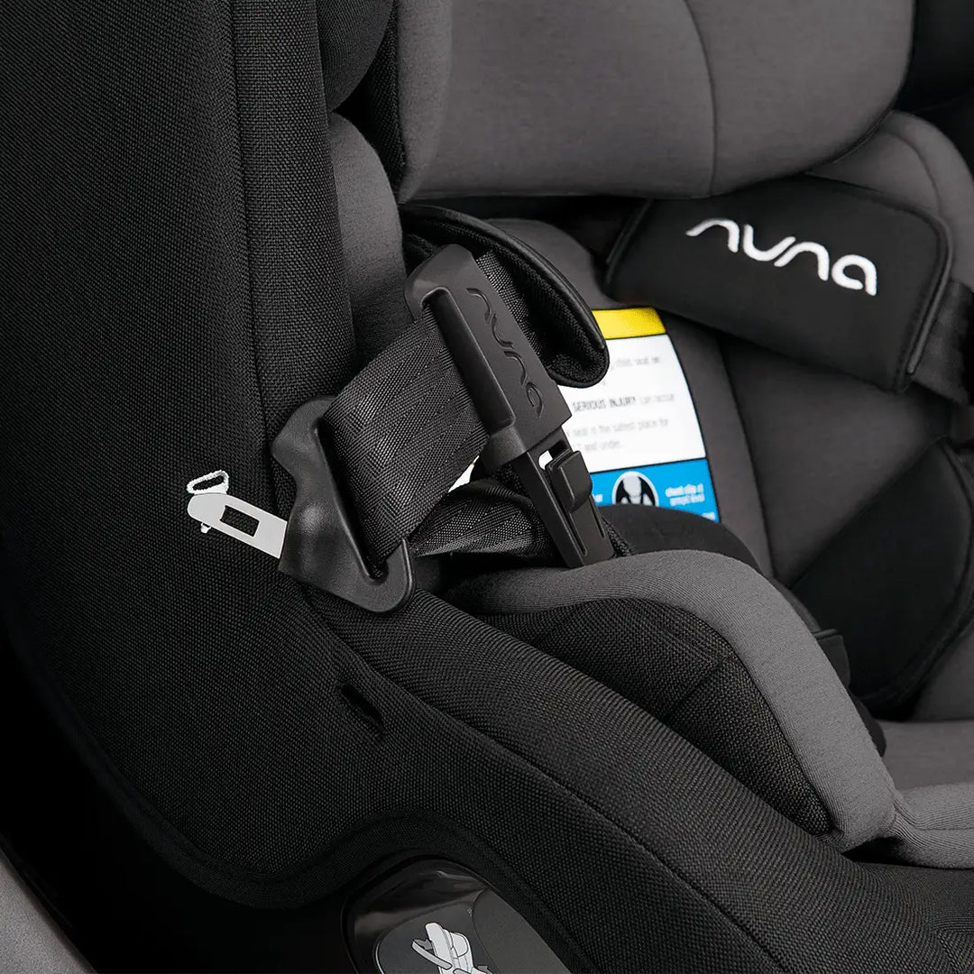 Nuna revv™ car seat showing seat belt installation