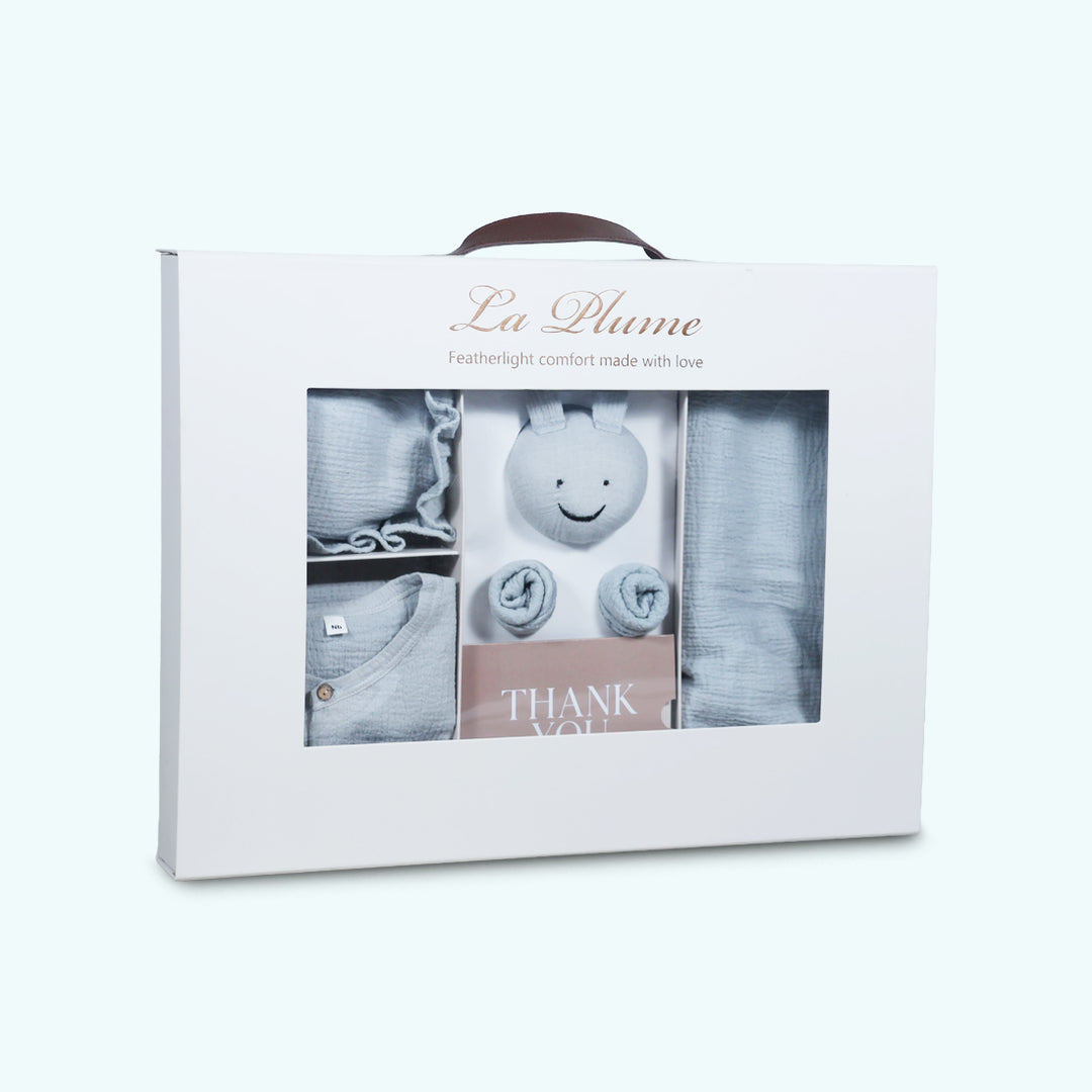 La Plume 7-Piece Muslin Newborn Gift Set | Swaddle, Romper, Bib, Washcloths, Pillow &amp; Soft Toy