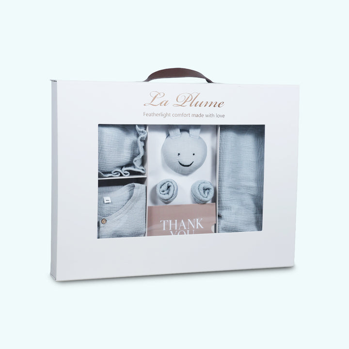 La Plume 7-Piece Muslin Newborn Gift Set | Swaddle, Romper, Bib, Washcloths, Pillow &amp; Soft Toy