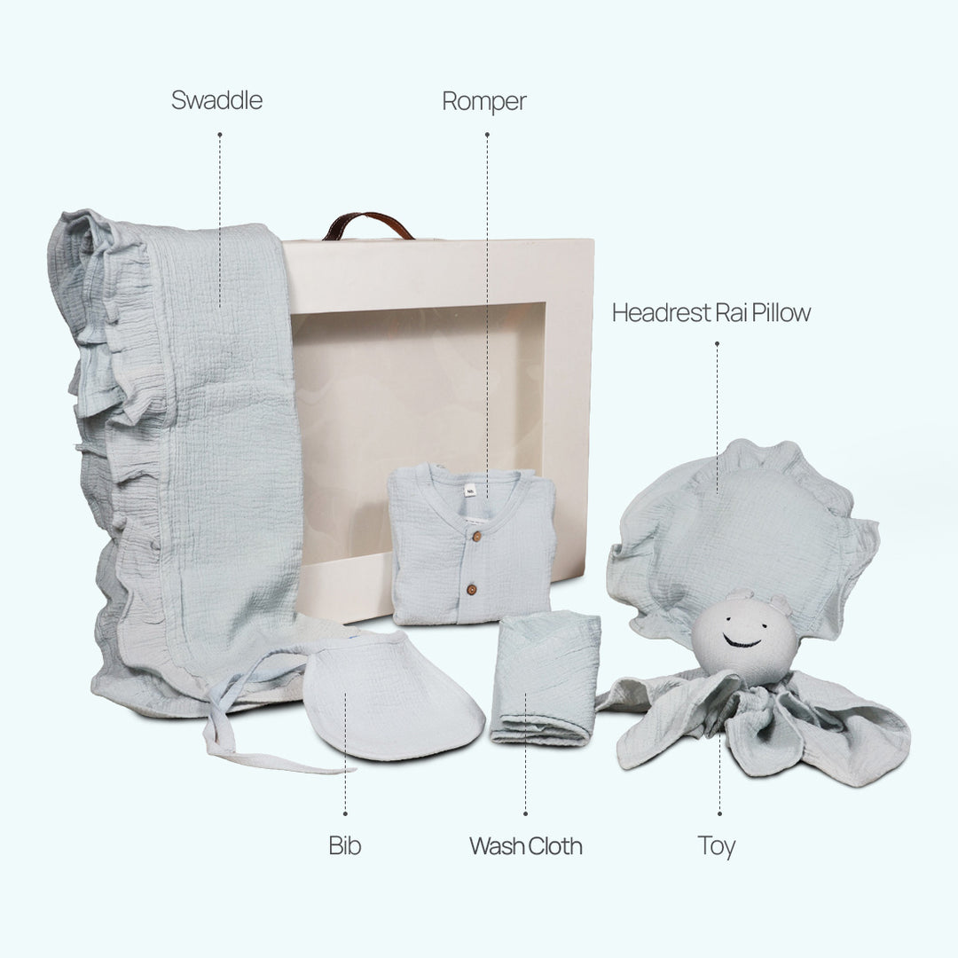 La Plume 7-Piece Muslin Newborn Gift Set | Swaddle, Romper, Bib, Washcloths, Pillow &amp; Soft Toy