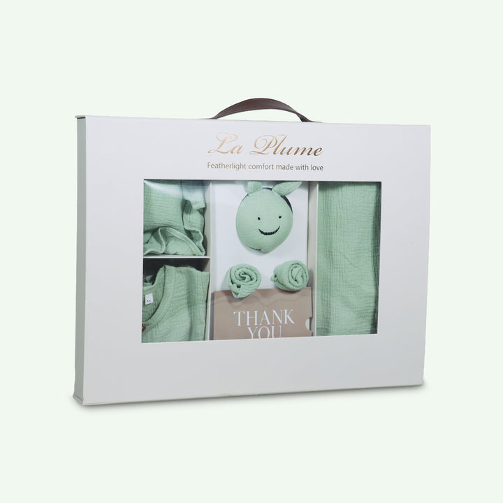 La Plume 7-Piece Muslin Newborn Gift Set | Swaddle, Romper, Bib, Washcloths, Pillow &amp; Soft Toy