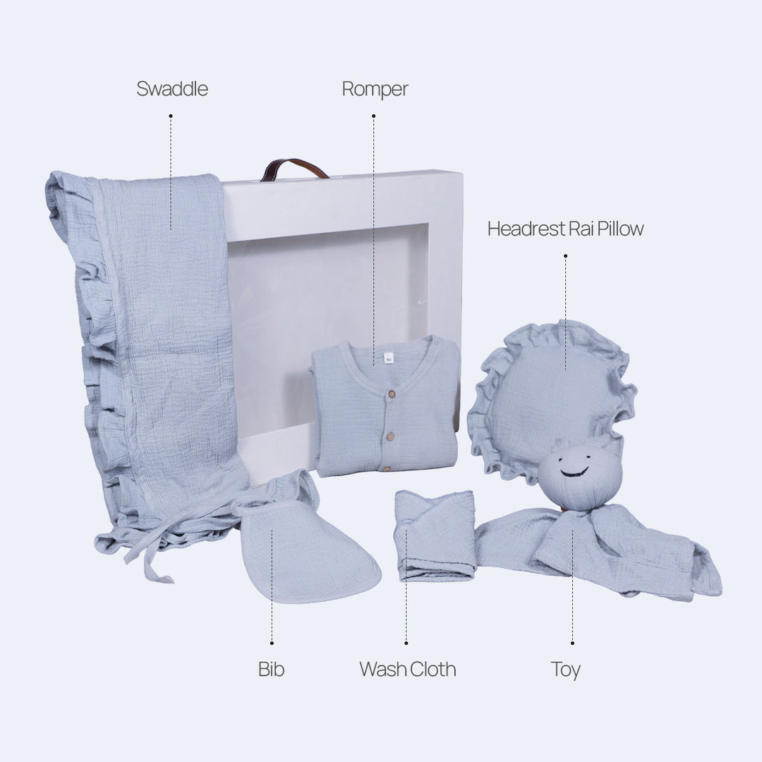 La Plume 7-Piece Muslin Newborn Gift Set | Swaddle, Romper, Bib, Washcloths, Pillow &amp; Soft Toy