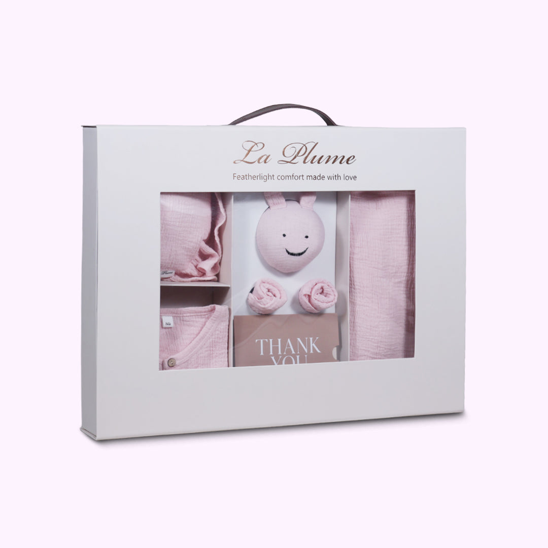 La Plume 7-Piece Muslin Newborn Gift Set | Swaddle, Romper, Bib, Washcloths, Pillow &amp; Soft Toy