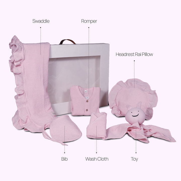 La Plume 7-Piece Muslin Newborn Gift Set | Swaddle, Romper, Bib, Washcloths, Pillow &amp; Soft Toy