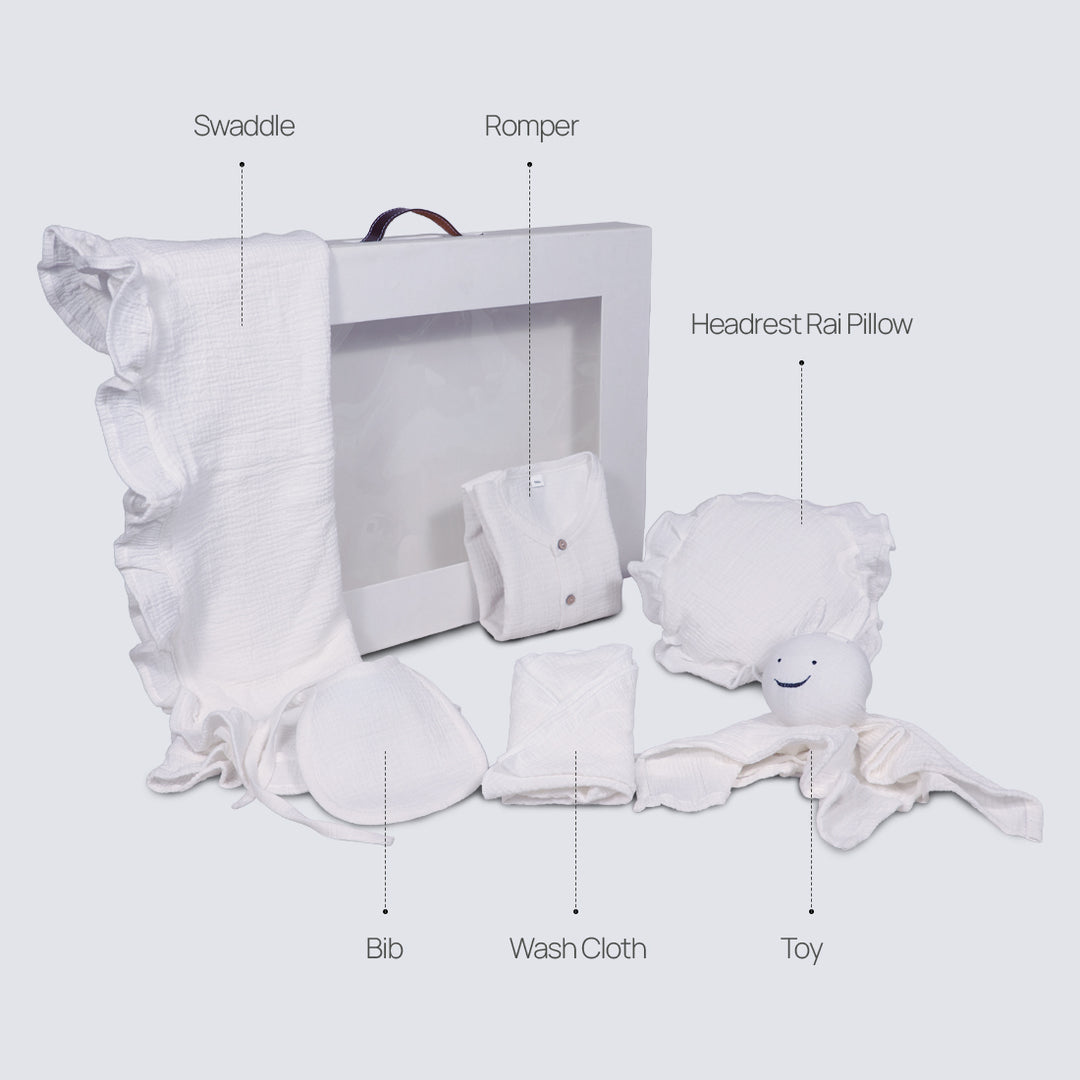 La Plume 7-Piece Muslin Newborn Gift Set | Swaddle, Romper, Bib, Washcloths, Pillow &amp; Soft Toy
