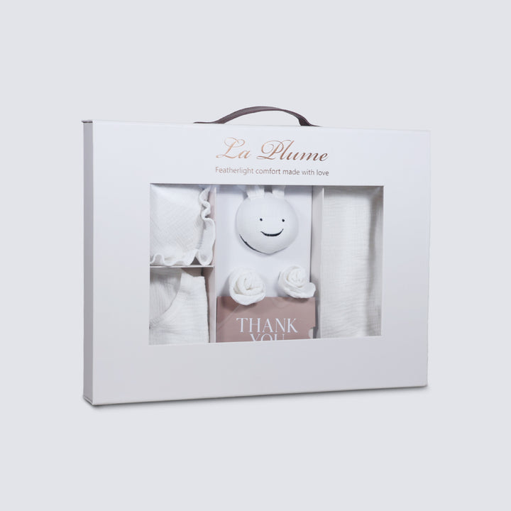 La Plume 7-Piece Muslin Newborn Gift Set | Swaddle, Romper, Bib, Washcloths, Pillow &amp; Soft Toy